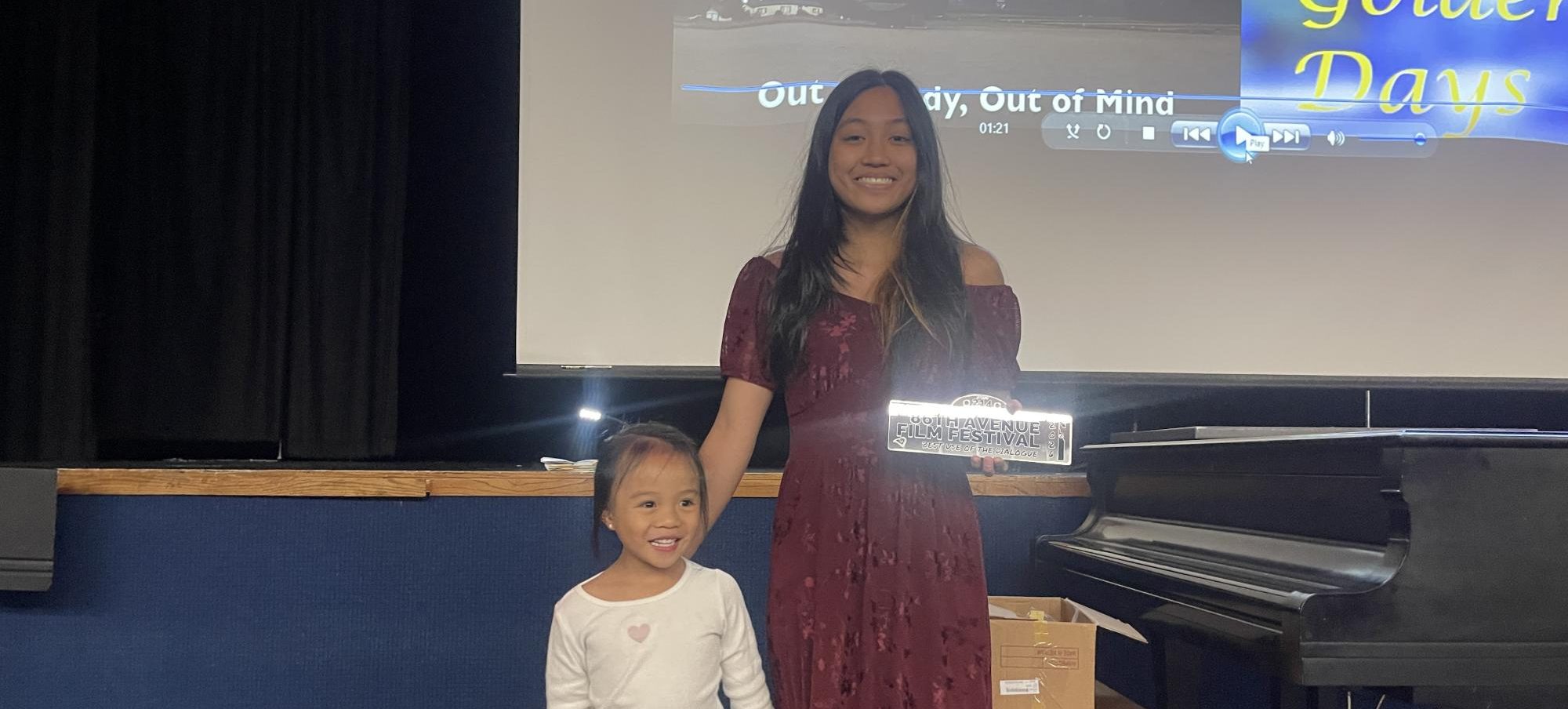 Espi Carlos and her sister accept the award for best use of dialogue.